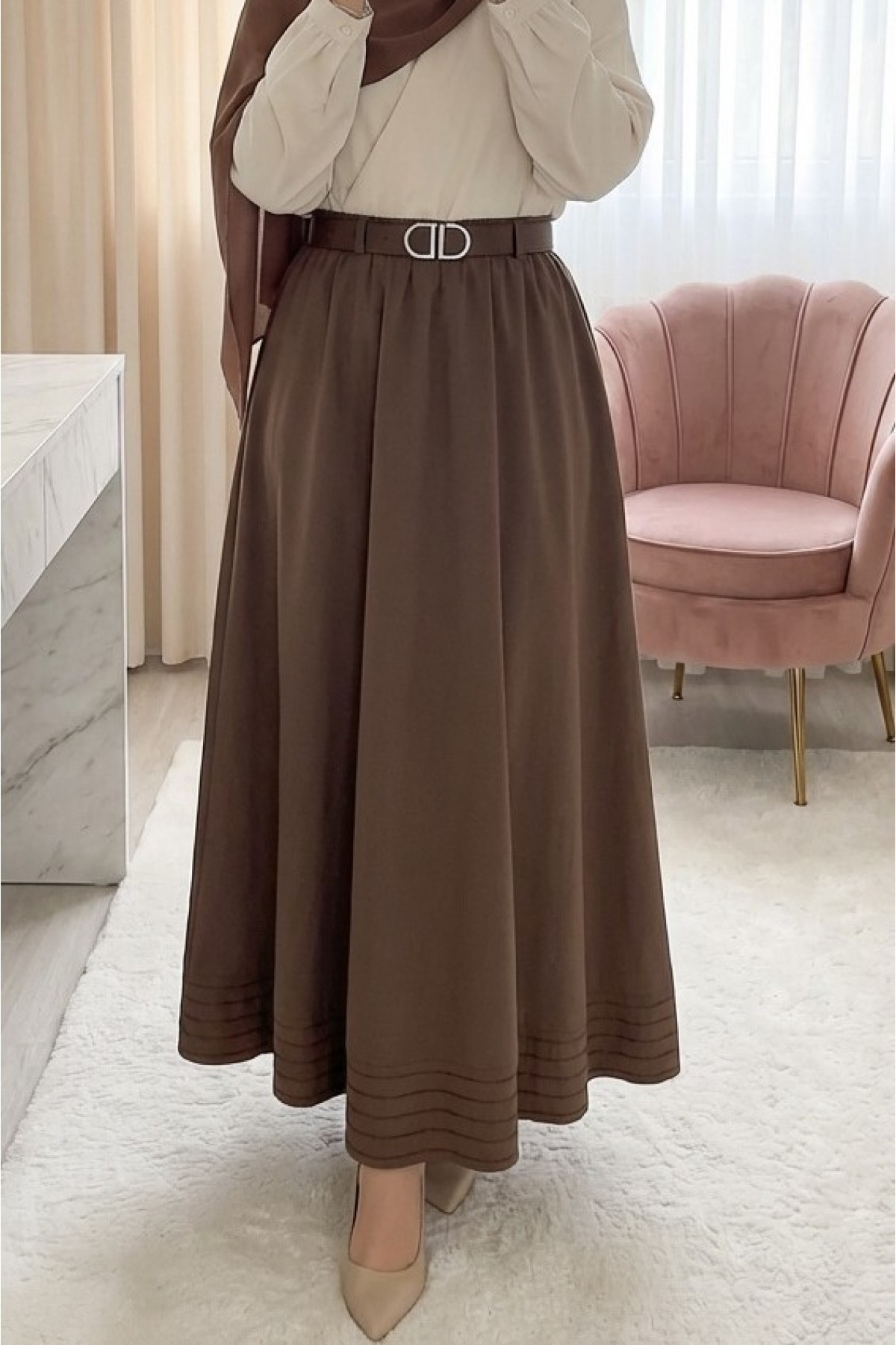 Imported soft gabardine skirt with hem stitching detail, elasticated waist, and lining. -Brown