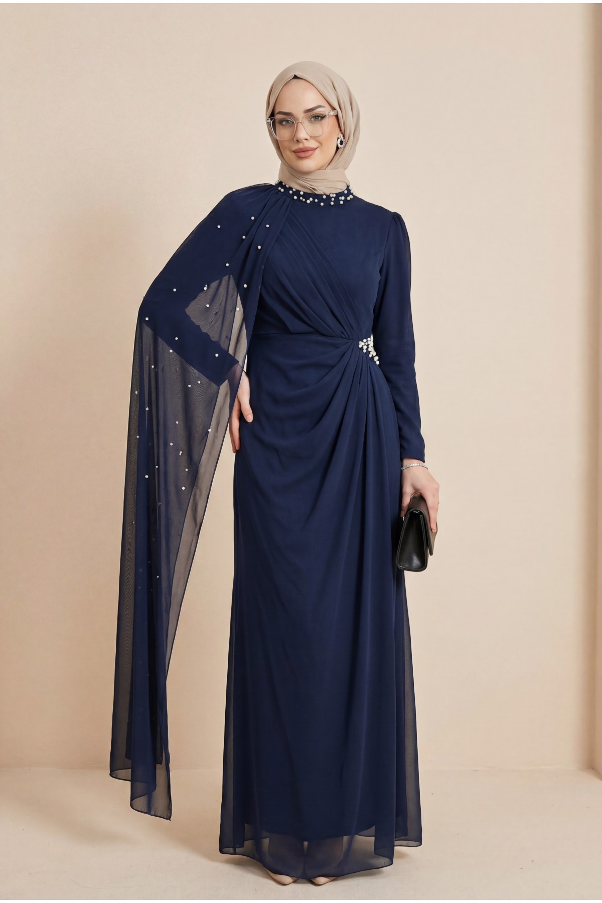 High-neck evening gown with pearl detail and tulle cape. -Navy blue