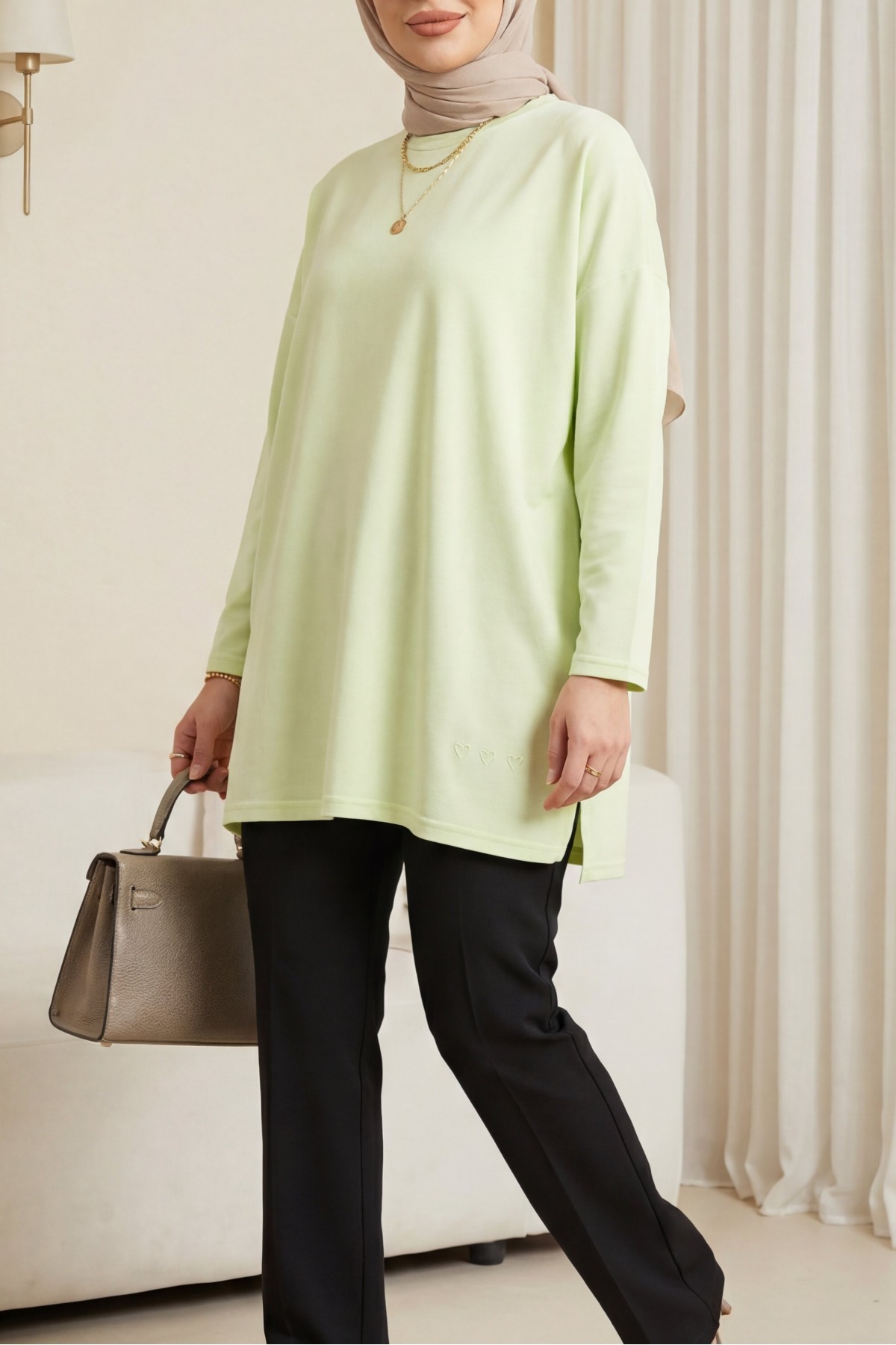 Loose-fitting cotton tunic with heart detail and slit at the hem. -Light yellow