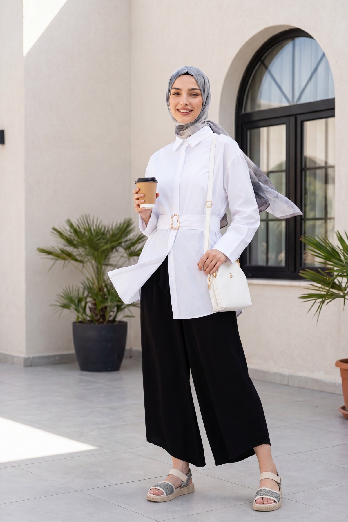 Linen-look skirt/pants with elasticated waist, belt, and pockets. -Black